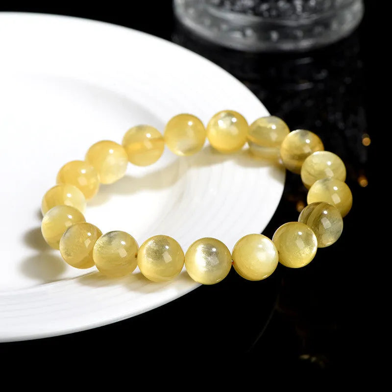Handmade yellow lepidolite mica bead bracelet with geometric shapes and polished finish