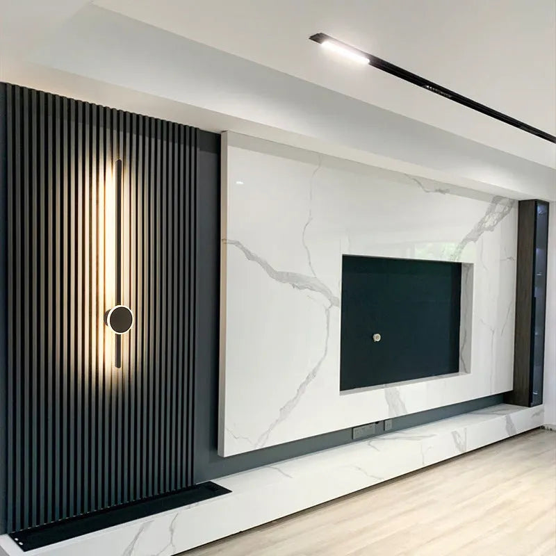 Simple modern wall lamp with a long acrylic shade and grid-free strip light design.