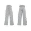 Men's dark blue straight-leg jeans with zipper decorations and tassel details on a loose cotton fit.