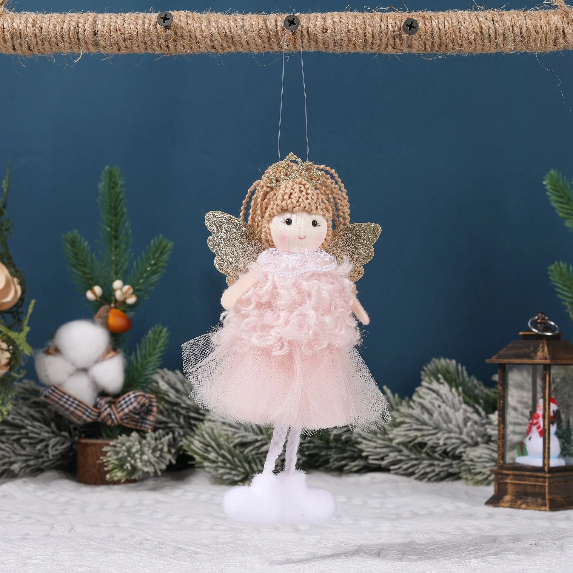 Close-up of a girl's cloth Christmas angel hair pendant clip in white, shown on a high ponytail.