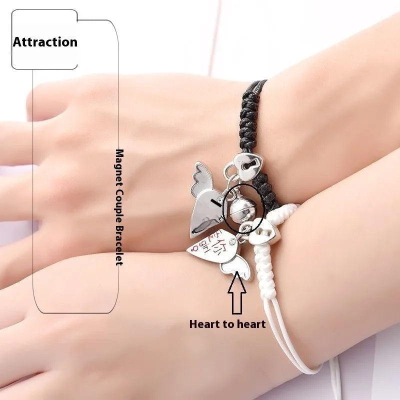 A pair of magnet couple bracelets in alloy with electroplated finish, showing styles like crown, clover, and love lock.