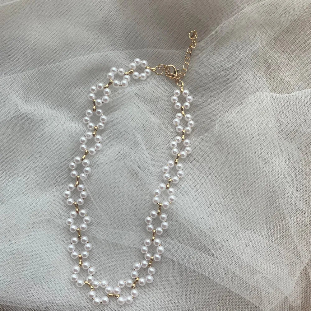 Pearl necklace and bracelet set for women on white background