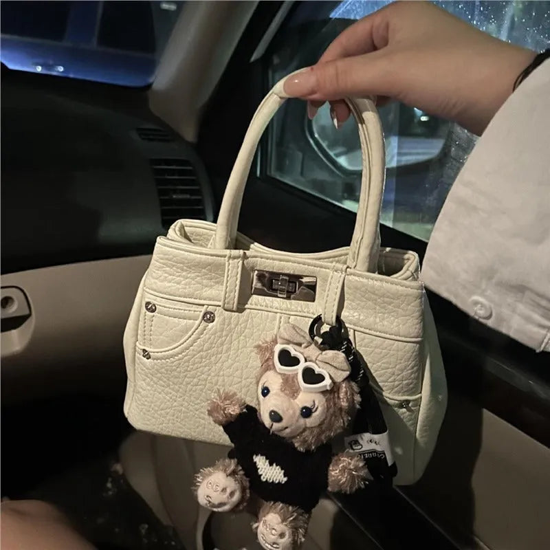 Women's casual denim shoulder handbag in soft PU material with standard sizing and polyester lining