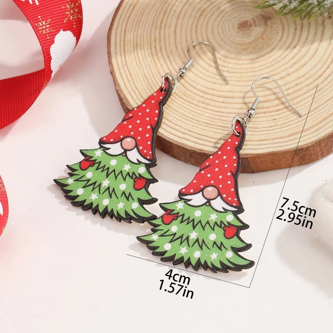 Pair of wooden geometric Christmas earrings with Santa Claus design in red and green colours.
