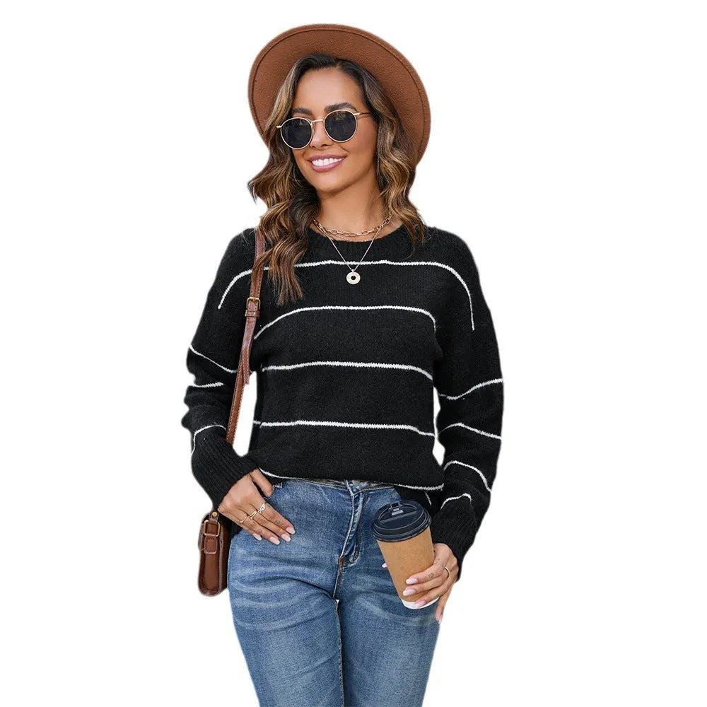 Women's black and white striped pullover sweater with loose fit and round neck