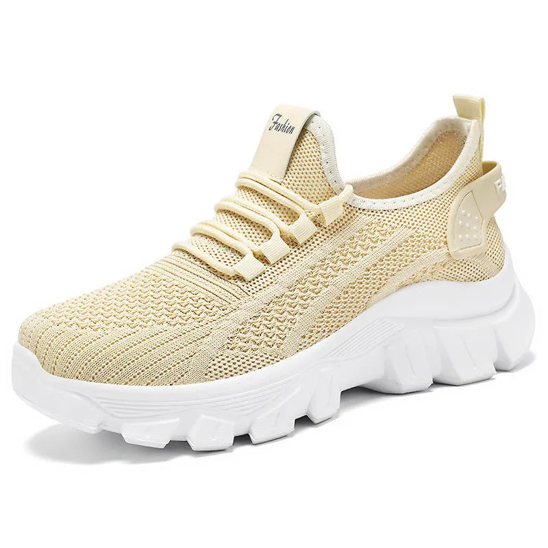 Women's Flyknit sneakers in white colour with round toe and lace-up front