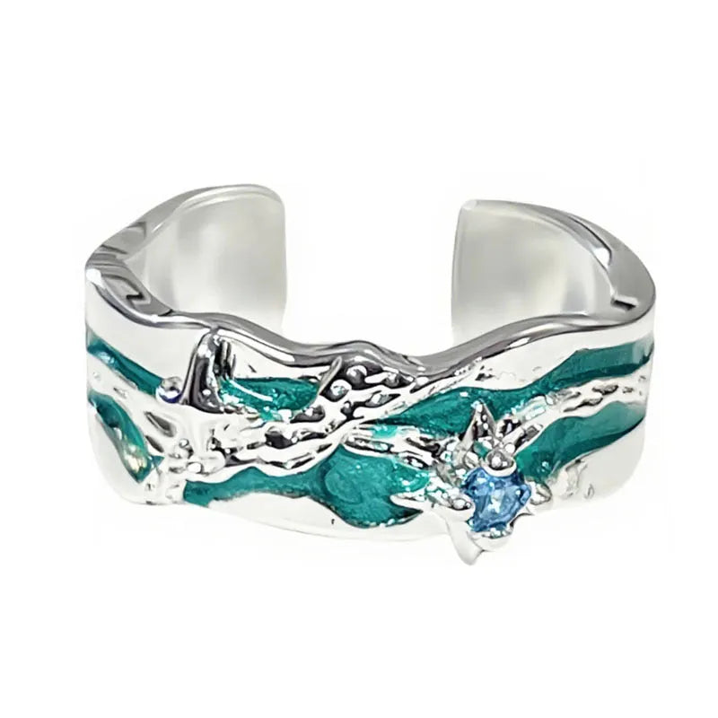 Mint green enamel asterism ring with asymmetric folded copper design and eight-point star pattern