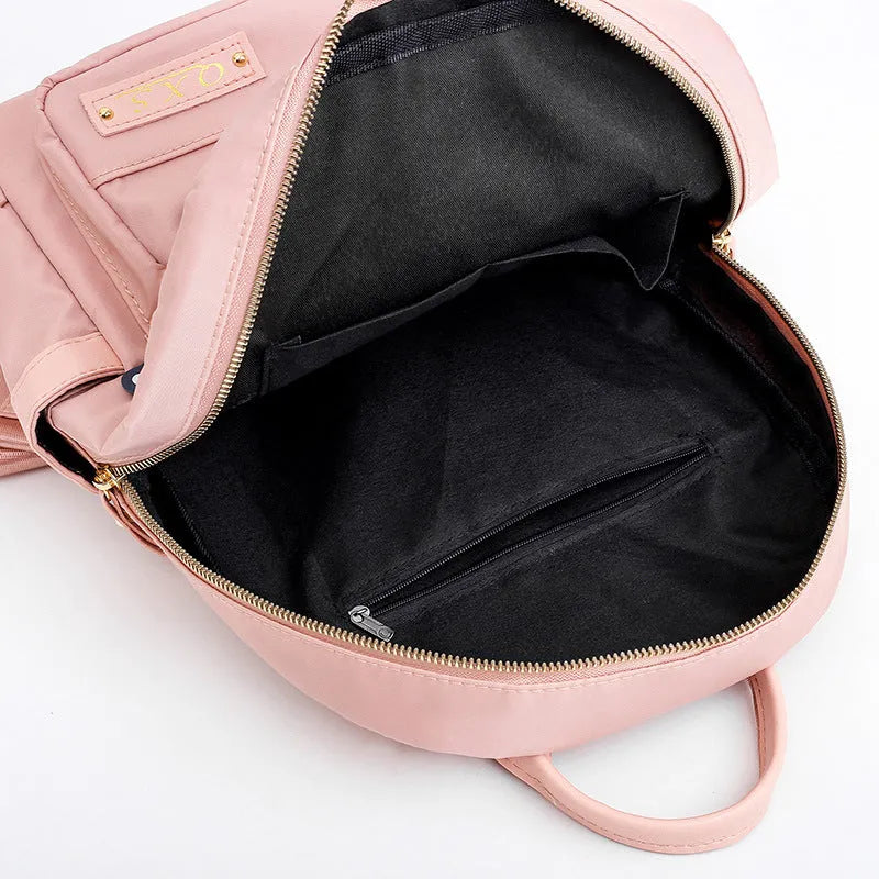 Women's black nylon backpack with anti-theft pockets and water-resistant finish.
