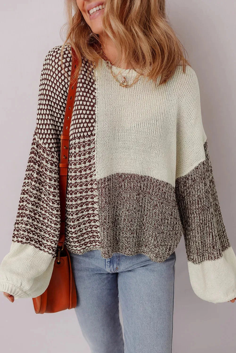 Dark khaki loose drop shoulder sweater with a colour block back panel and tie detail.