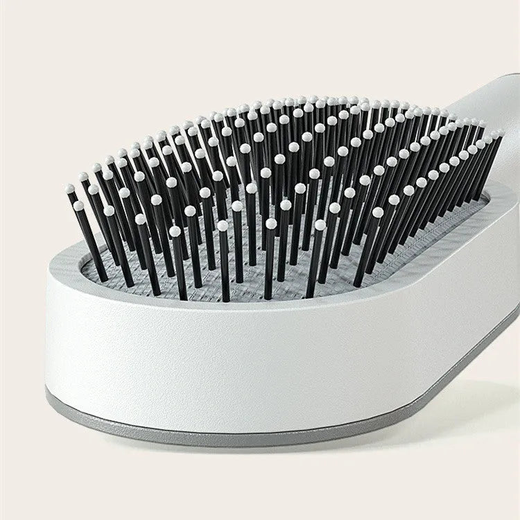 Self cleaning hair brush with one-key cleaning button and air cushion massage design in various colour options
