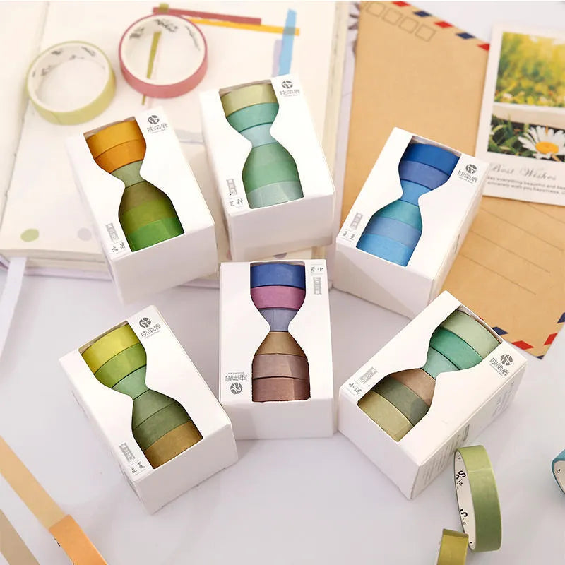 Six rolls of solid colour ledger tape labelled with solar term names, each 9mm wide, on a white background.