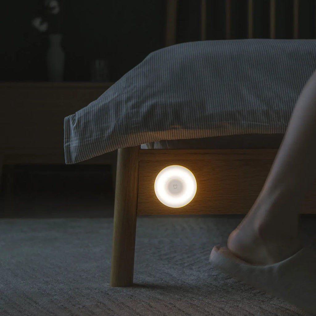 White modern bedside table lamp with human body induction and Bluetooth.