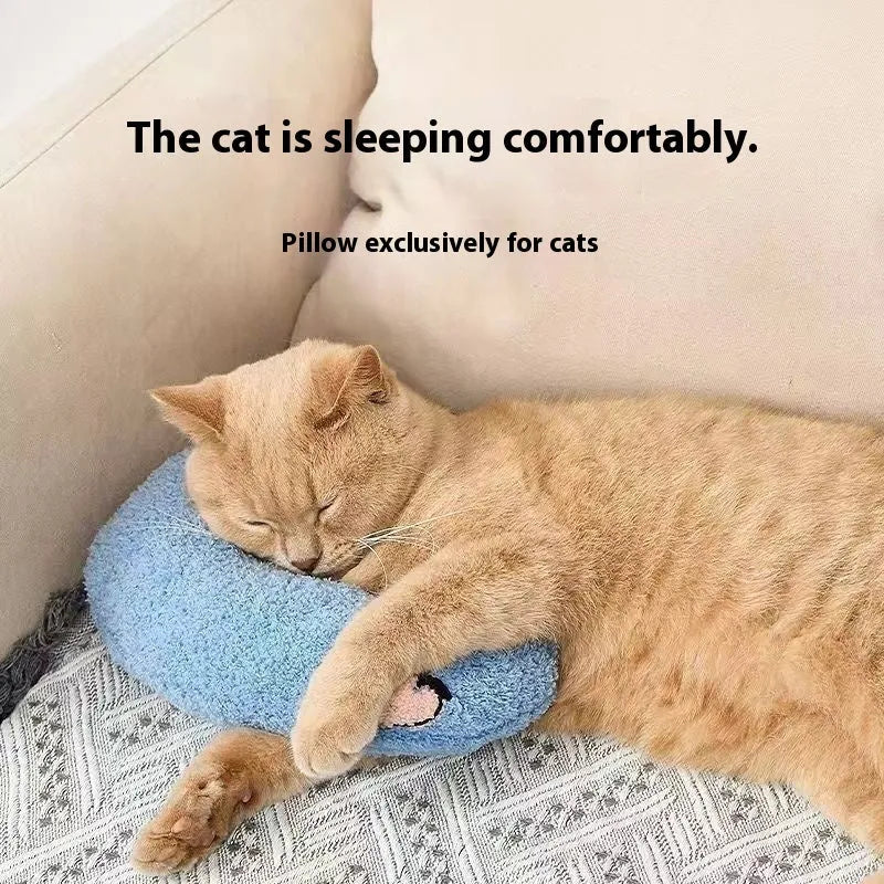 Blue and yellow question mark shaped cat bed with a built-in U-shaped neck support pillow on a wooden floor.