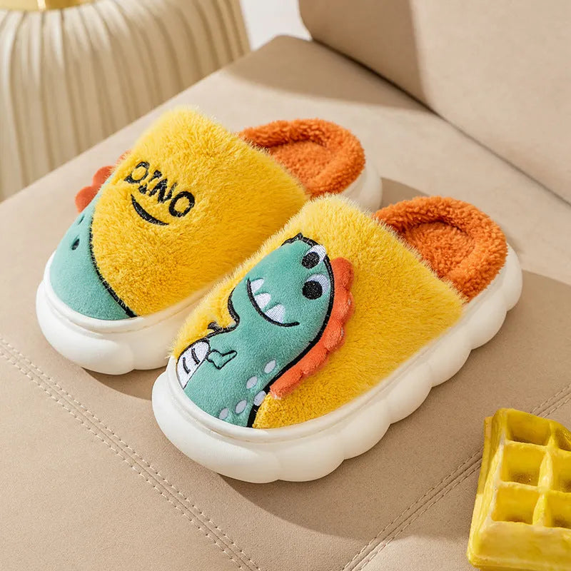 A pair of plush cotton couple slippers in a dinosaur colour pattern, showing the thickened sole.