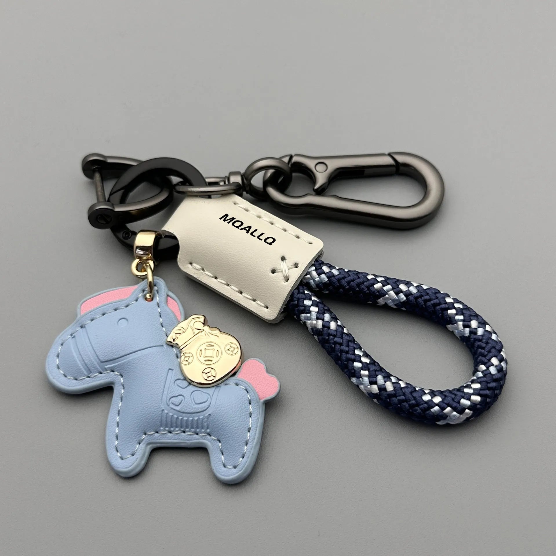 Handmade cowhide car key ring pendant with zinc alloy pony belt buckle on a colourful flanelle rope.