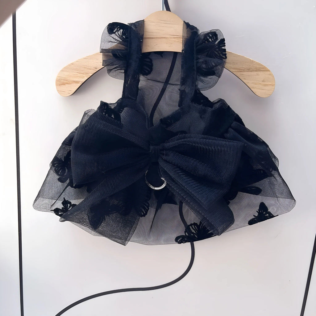 Black layered tulle princess skirt on a small dog, showing the full skirt silhouette and secure fit.