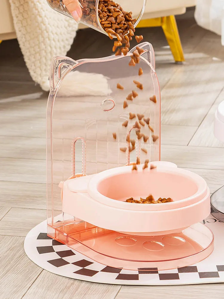 Grey adjustable height cat feeding bowl with anti-spill neck protection hanging on cage bars.
