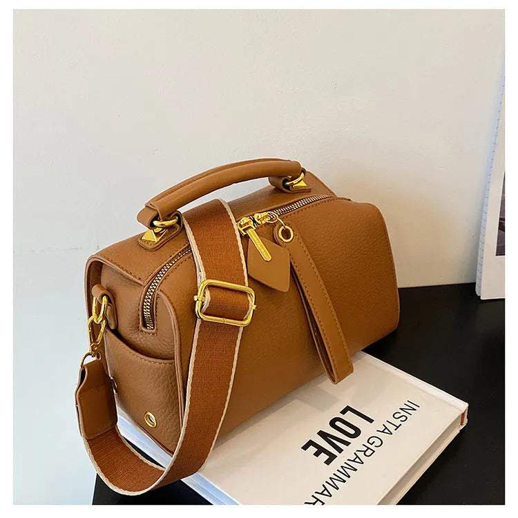 PU leather shoulder messenger bag with outer slit pocket and crossbody strap in black colour