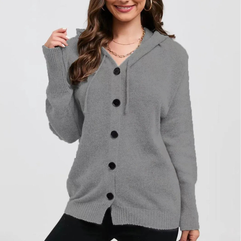 Women's loose-fit hooded cardigan in thick coloured cotton, shown in a solid colour with long sleeves.