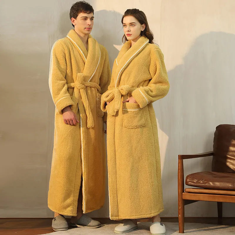 A man and woman wearing matching heavyweight navy blue flannel bathrobes, a couple's winter nightgown set.