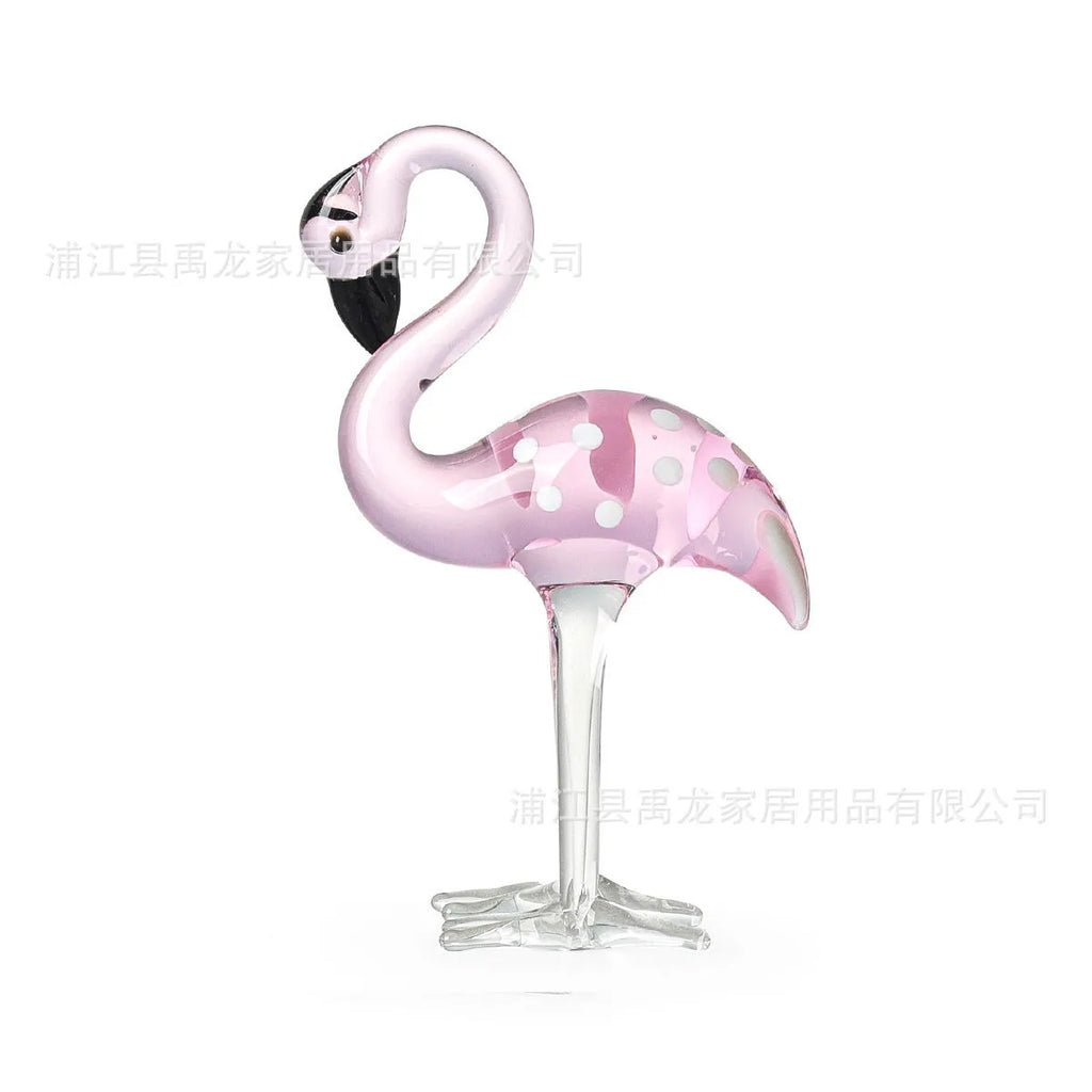 Pink crystal flamingo decorative ornament on a table for modern home decor.