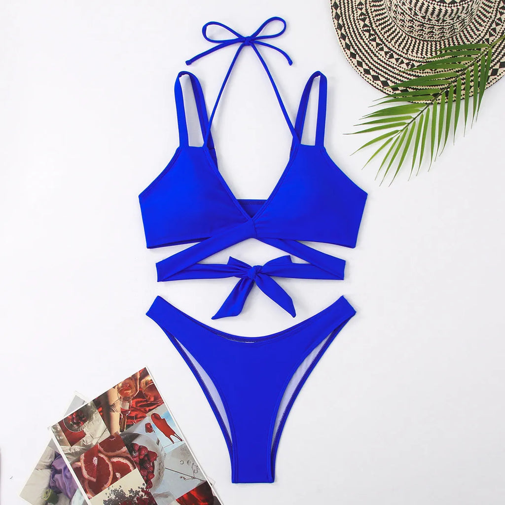 Solid colour women's brief bikini swimsuit on a mannequin, showcasing the strap design.