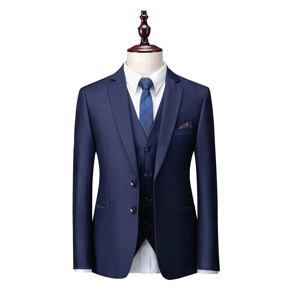 Men's navy blue three-piece plaid business casual suit with slim fit cut showing jacket, vest, and trousers