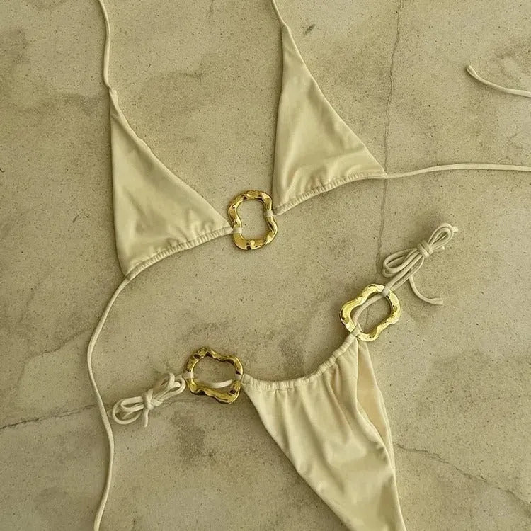 Women's halter neck bikini set with lace-up back and low waist design in solid colour