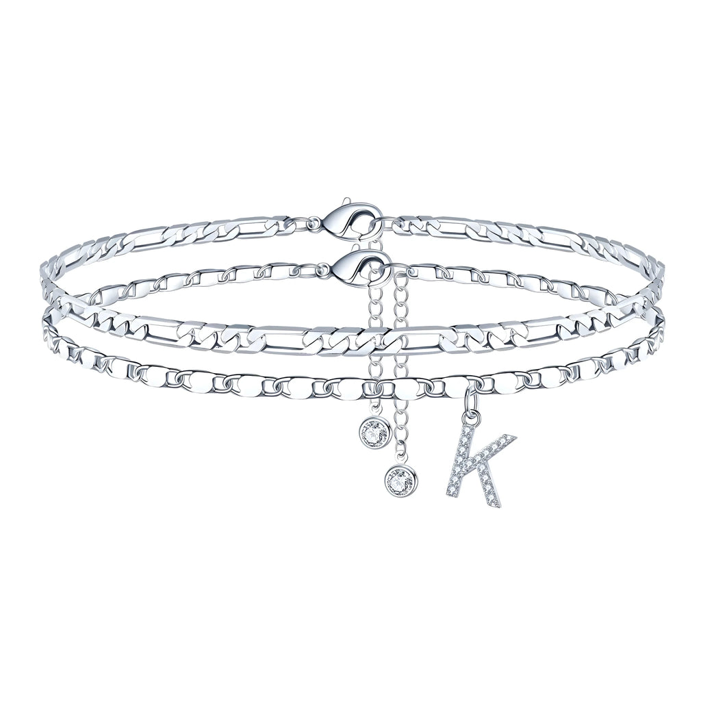 Silver-coloured copper anklet with a double-circle bead featuring a modelled letter charm.