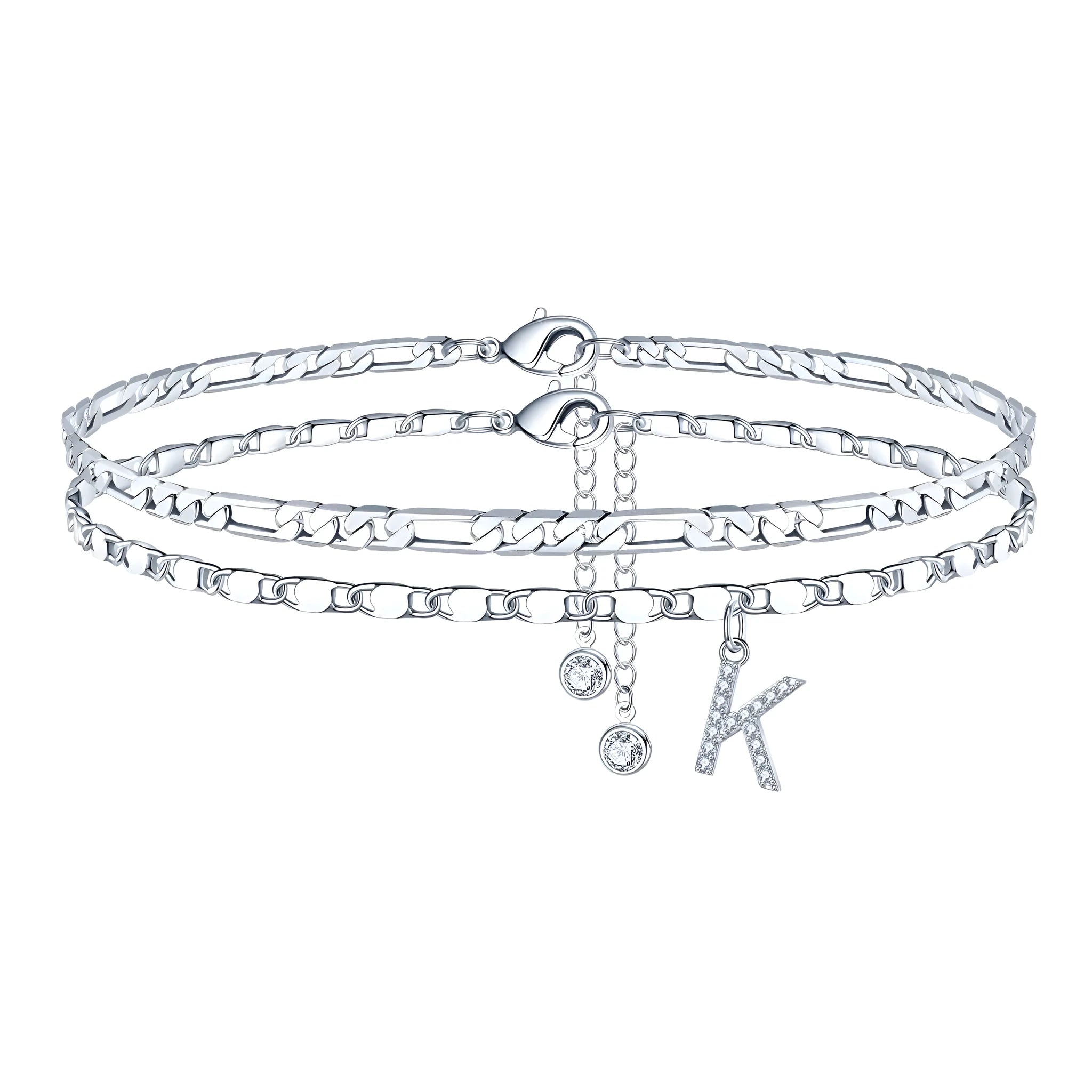 Silver-coloured copper anklet with a double-circle bead featuring a modelled letter charm.