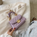 Purple Korean-style ladies square crossbody bag with soft PU texture on a table.