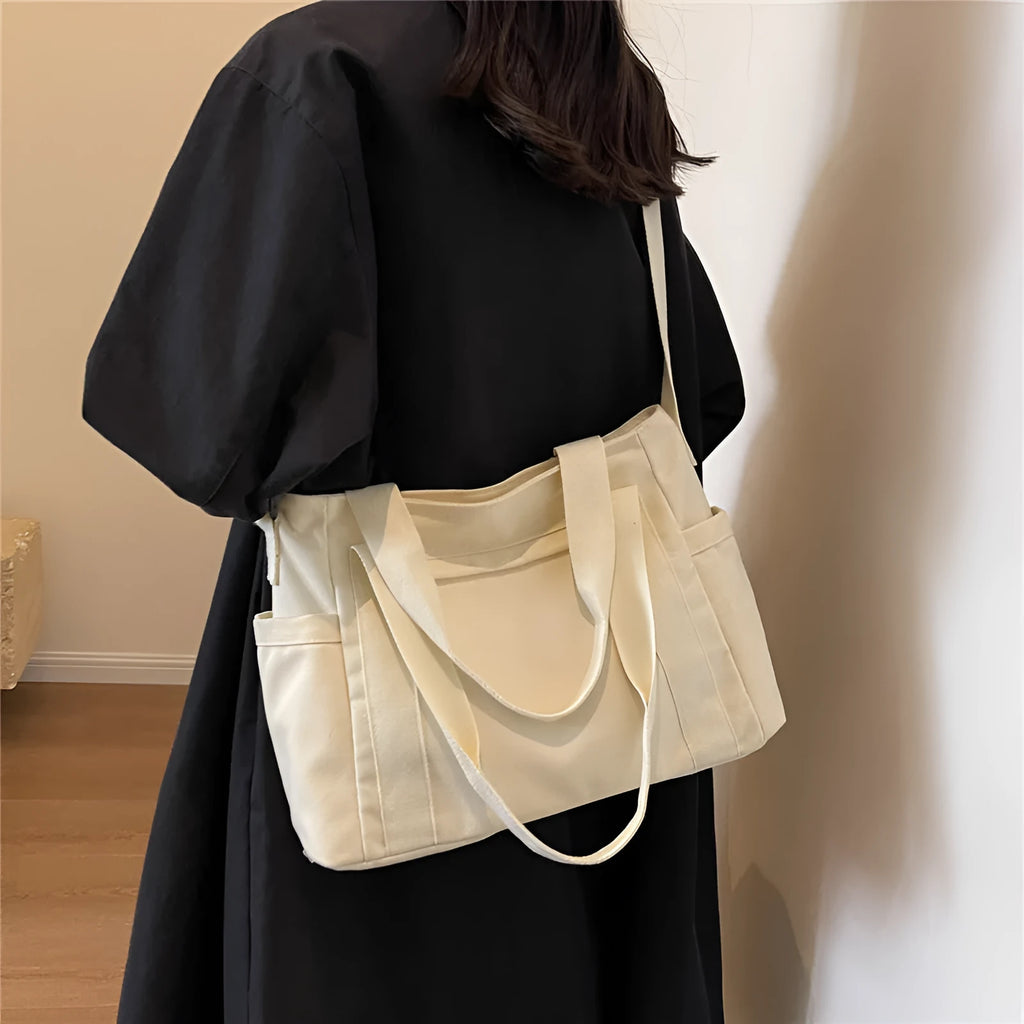 Large capacity polyester canvas shoulder tote bag with internal phone compartment in solid colour