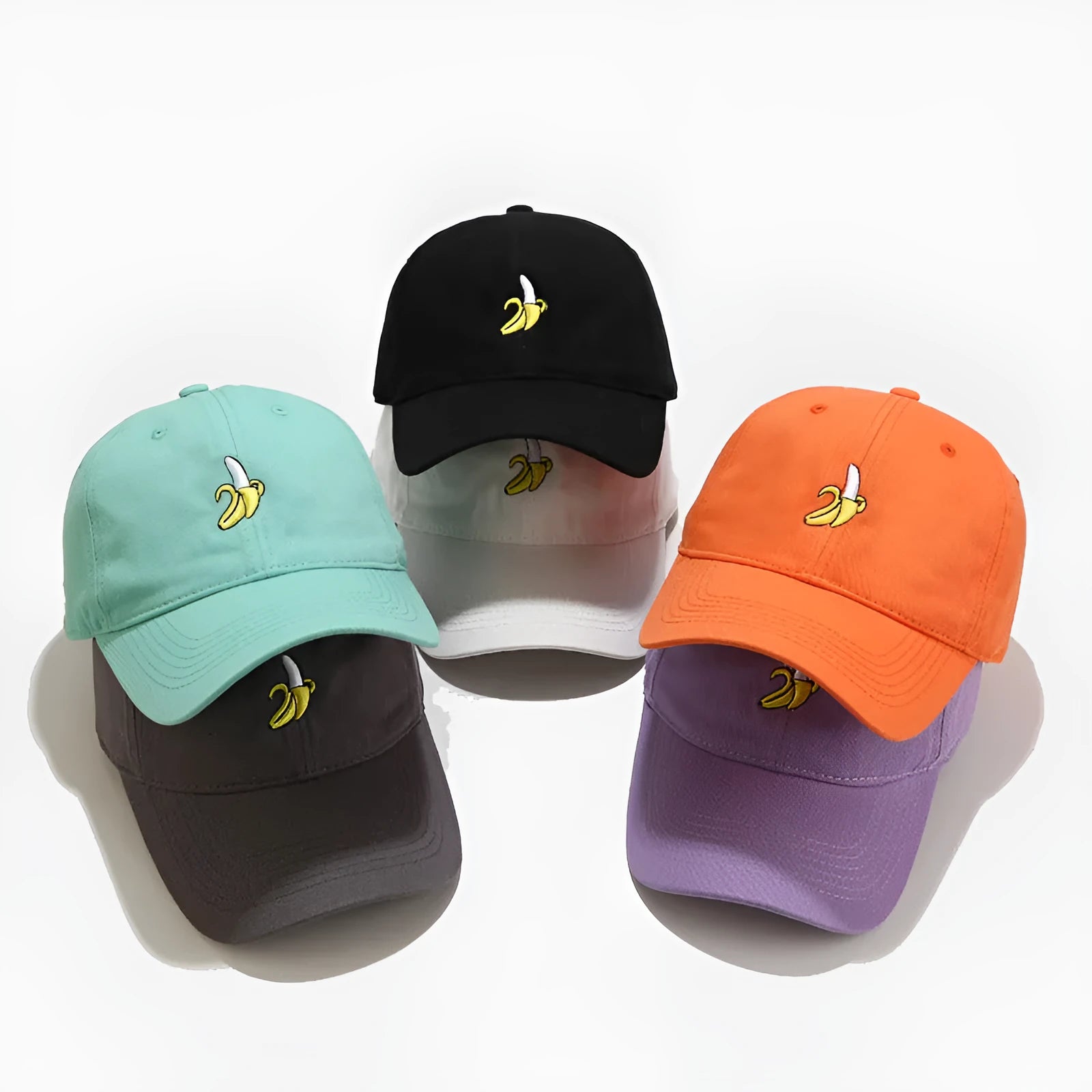 Cute banana fruit embroidered soft top baseball cap on adjustable strap, shown in peacock blue colour.