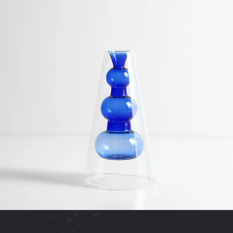 Small colourful double layer blown glass vase for dried flowers, yellow colour option on a table