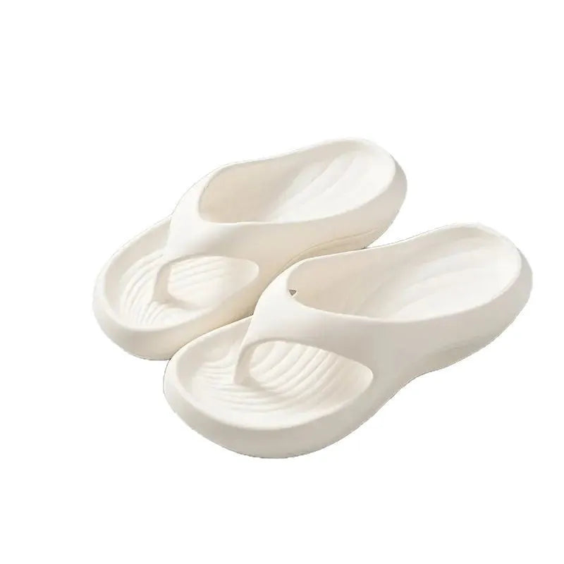 Women's thick-soled EVA flip-flops in black, white, or grey colours with non-slip sole design