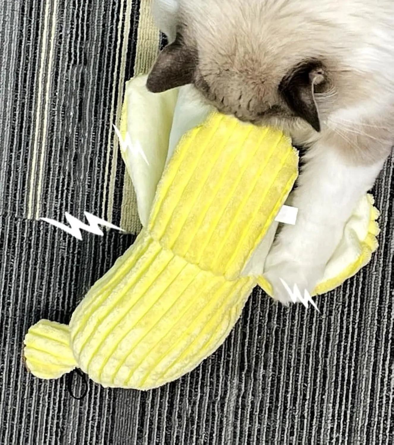 Yellow banana-shaped plush cat toy with a green tip and a textured velvet strip.