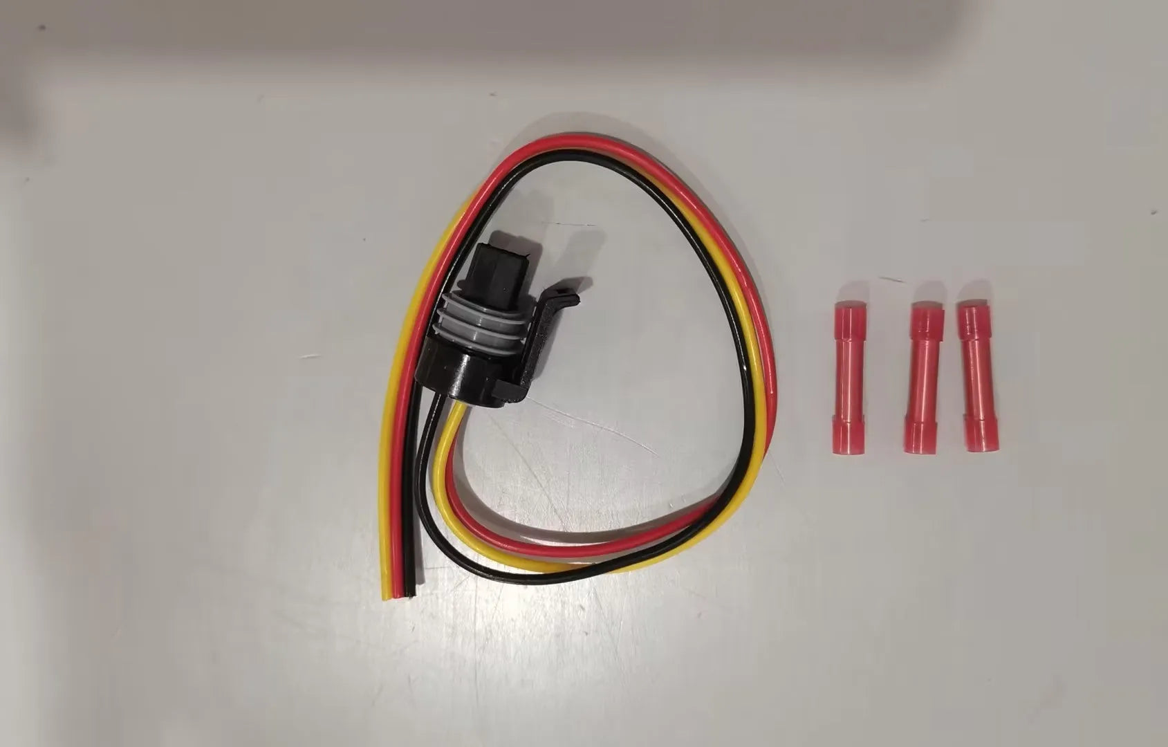 Ford F6TZ-9F838-A automotive pressure sensor with attached connector wire.