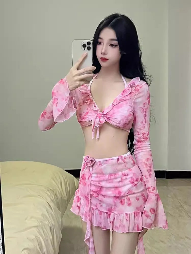 Women's cherry blossom pink floral print bikini swimsuit set on a mannequin.