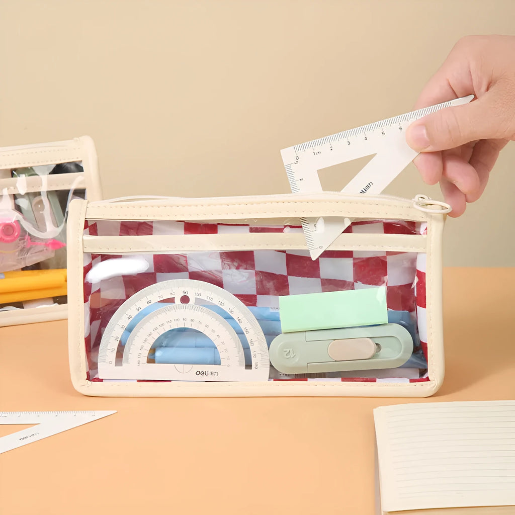 Transparent PVC pencil case with chessboard grid pattern, showing pens inside.