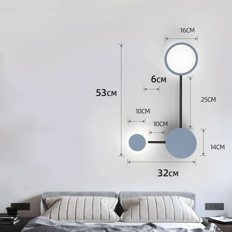 Contracted designer wall lamp with 6 heads in black iron and acrylic mounted on a bedroom wall