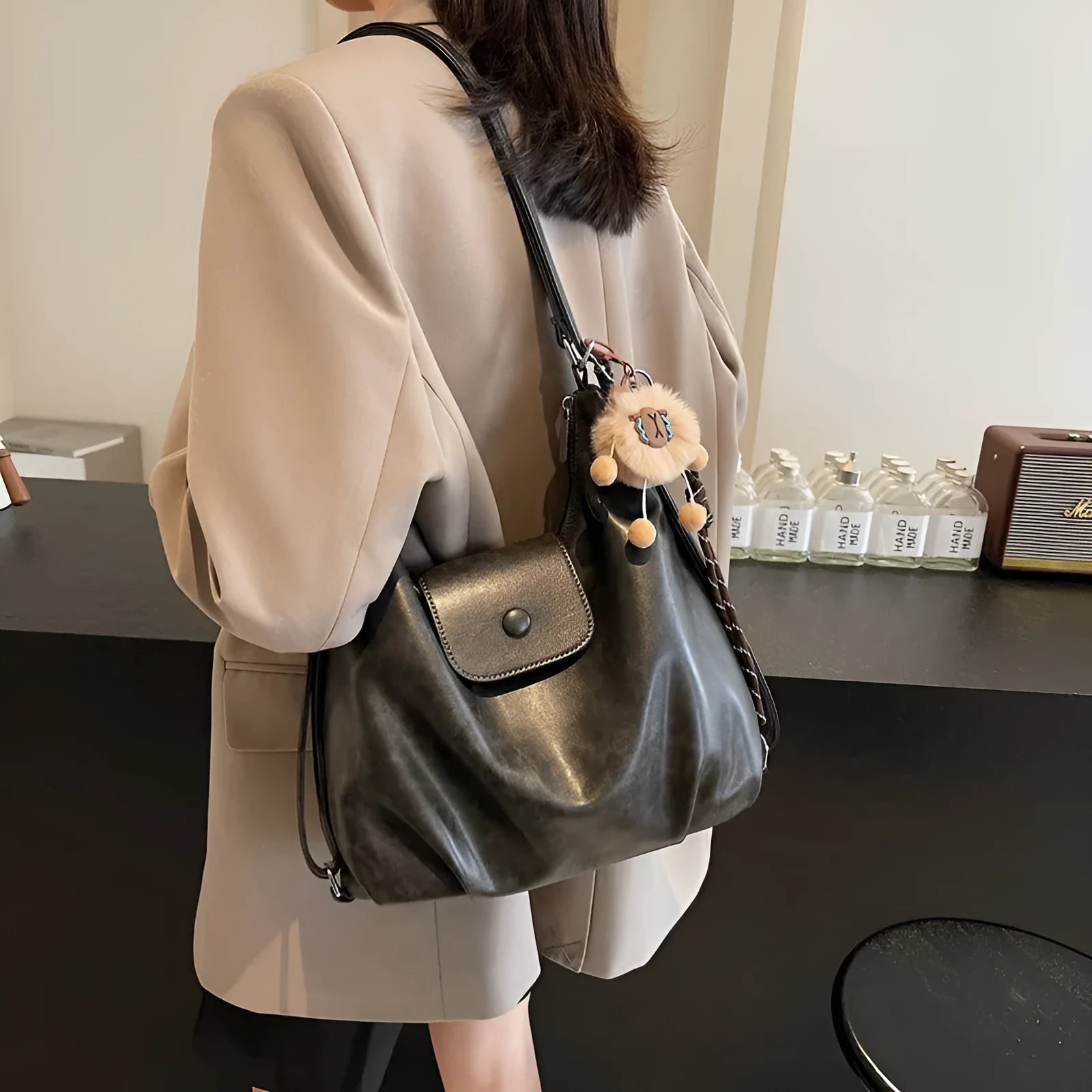 Textured PU leather women's shoulder bag with horizontal square shape and single strap in commuter backpack design