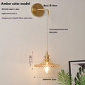 Retro brass lotus wall lamp with adjustable copper wire and white glass shade mounted on a wall.