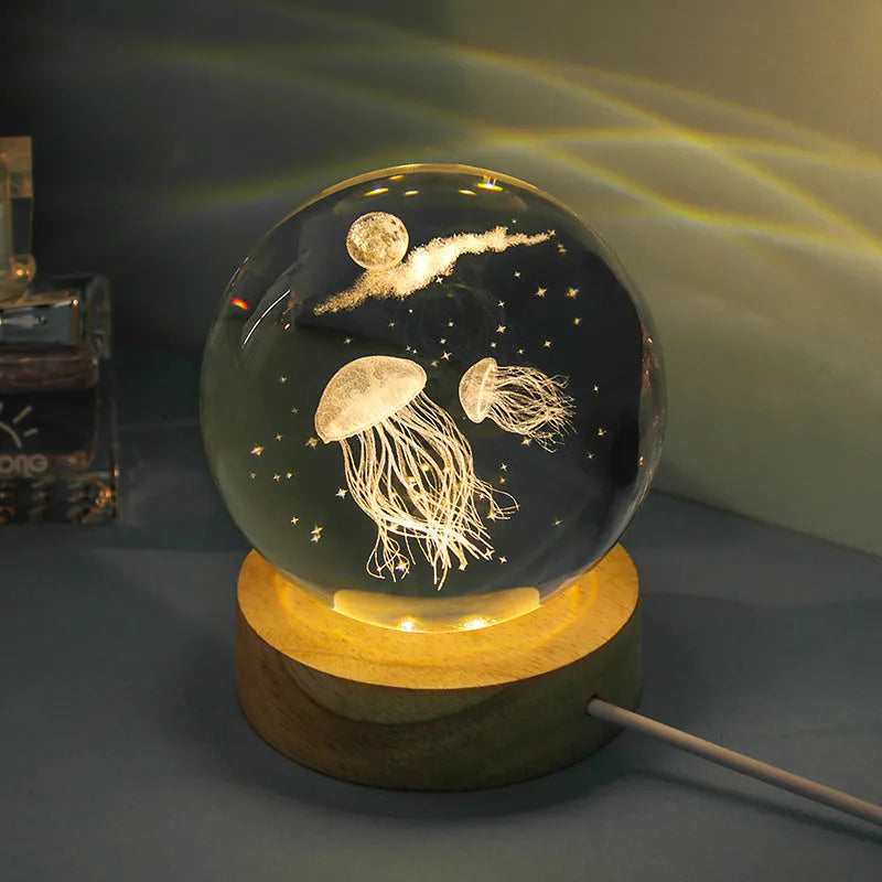 Transparent crystal ball night lamp with carved 3D jellyfish design, USB powered with optional natural light base