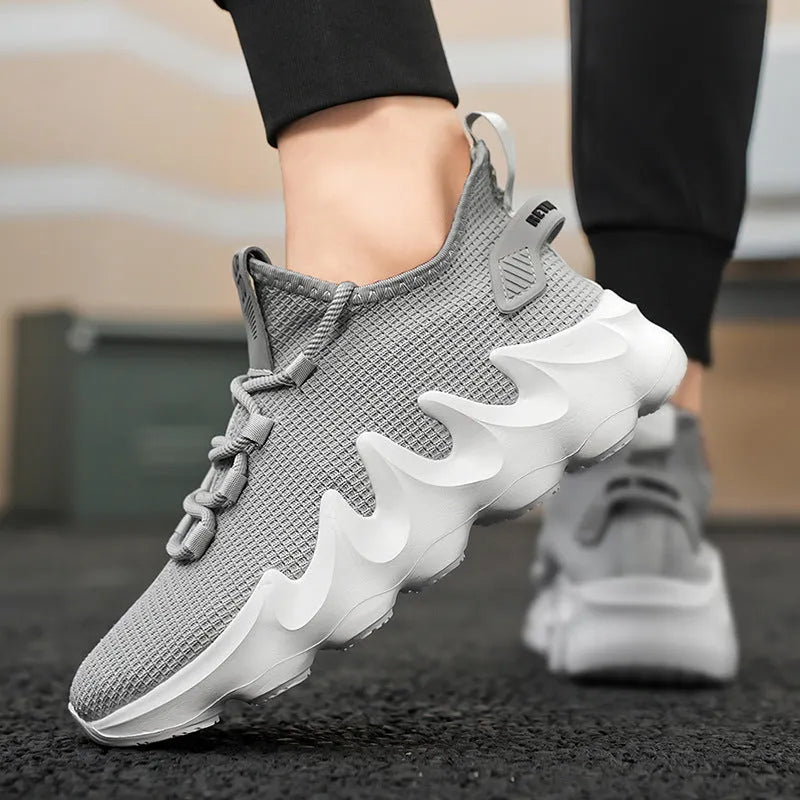 Men's black low-top sock-like sports shoes with a lace-up front and wear-resistant sole on a white background.
