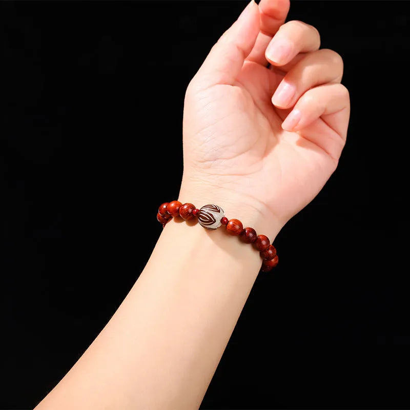 Red rosewood and grey jade women's bracelet with a geometric Bodhi lotus bead in Chinese style.