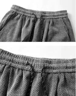 Man's grey straight-leg hollow-out casual trousers with elastic waist, shown in a plus size fit