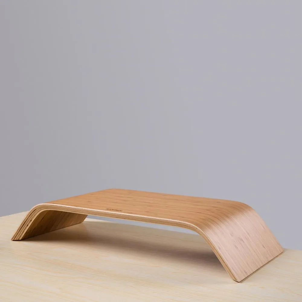 Walnut laptop stability bracket stand in bamboo leather colour on a desk