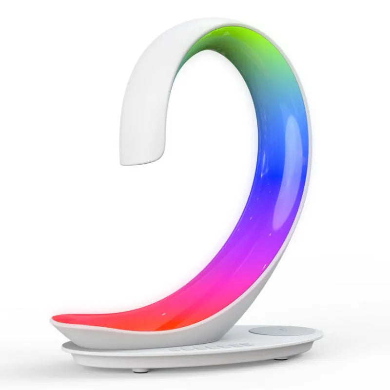 White swan-shaped desk lamp with colourful LEDs, integrated wireless charger, and Bluetooth speaker.