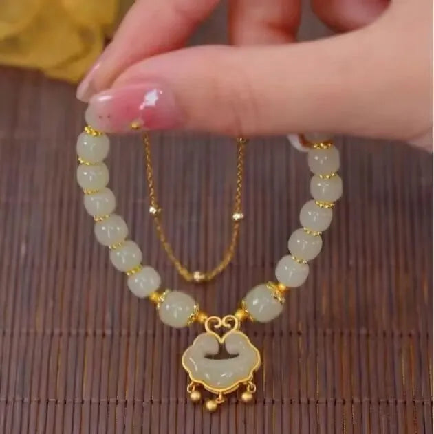 Women's green safety lock bell pendant bracelet with Xiangyun lock design on wrist