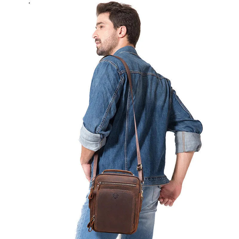 Men's brown genuine cowhide leather crossbody bag with retro styling and sewing line detailing